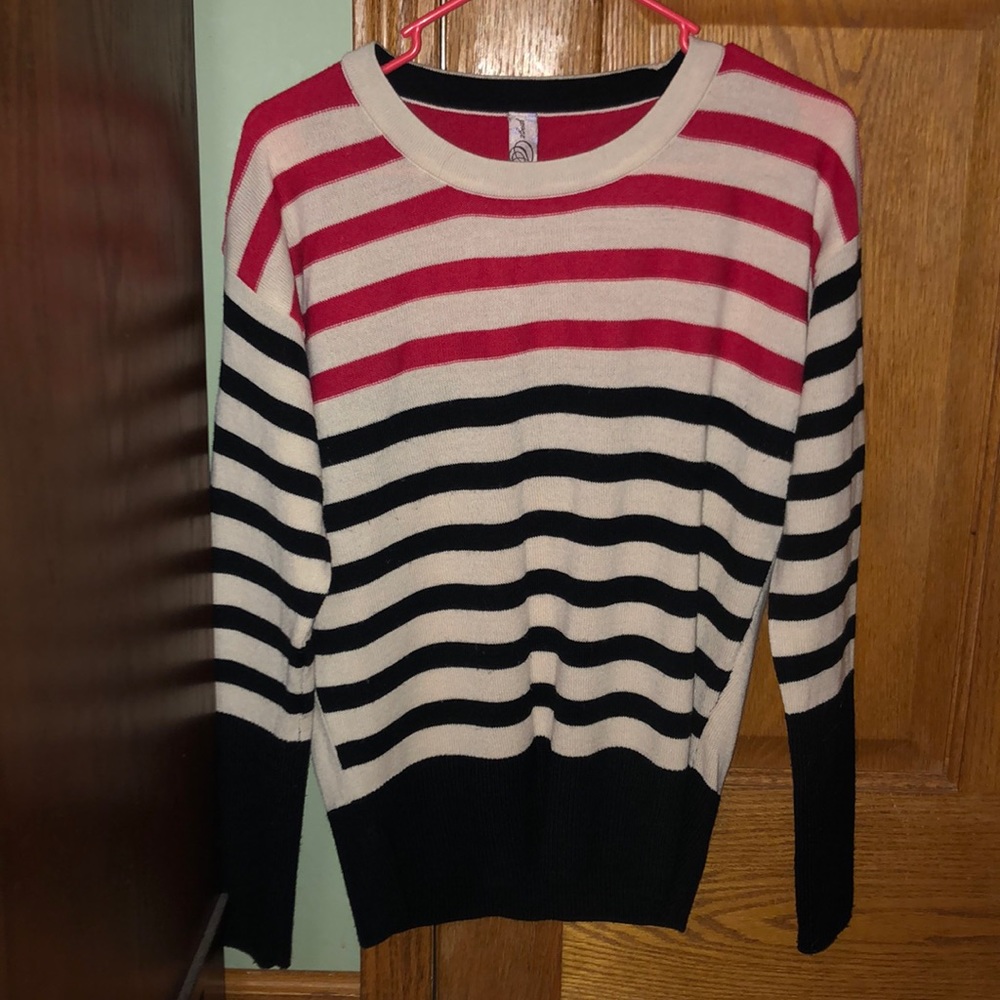 Red, black and cream sweater.